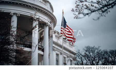 United States flag waving in the wind near the White House in Washington DC on a cloudy day 125064107