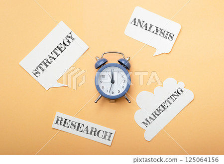 Clock with the words strategy, research, marketing Clock with the words strategy, research, marketing 125064156