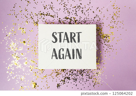 White card with the words start again written on it 125064202