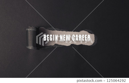 Black and white image of a paper with the words begin new career 125064292
