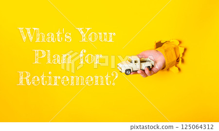 Hand holding a toy truck with the words What's your plan for retirement 125064312