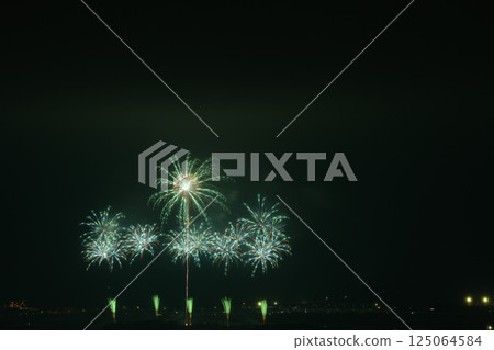 Fireworks color the night sky in early summer Fireworks color the night sky in early summer 125064584