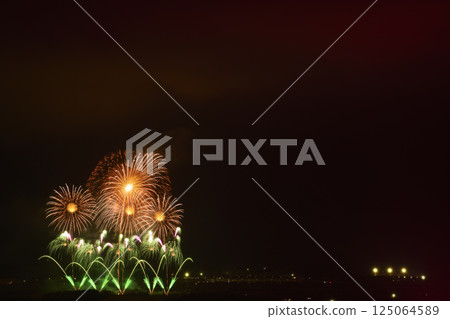 Fireworks color the night sky in early summer Fireworks color the night sky in early summer 125064589