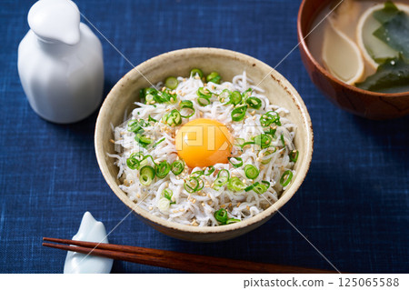 Boiled whitebait rice bowl topped with egg yolk Boiled whitebait rice bowl topped with egg yolk 125065588
