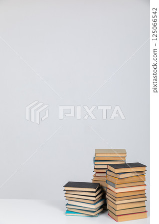 Stacks of books on a white background of the university library Stacks of books on a white background of the university library 125066542