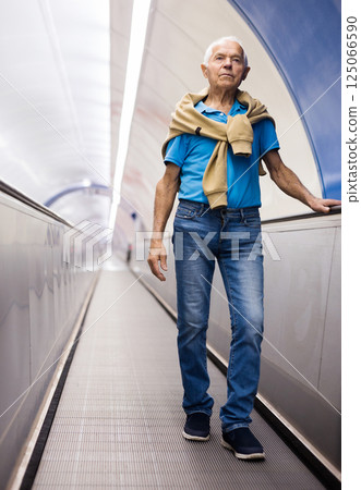 European old man going down to subway 125066590