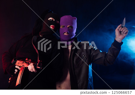 Man And Woman Wearing Mask With Gun Man And Woman Wearing Mask With Gun 125066657