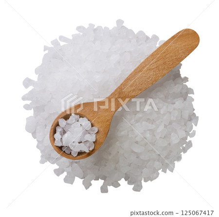 Heap of sea salt and wooden spoon close-up on a white. Top view Heap of sea salt and wooden spoon close-up on a white. Top view 125067417