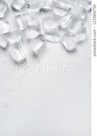 Melting ice cubes on a white background Melting ice cubes on a white background 125068756