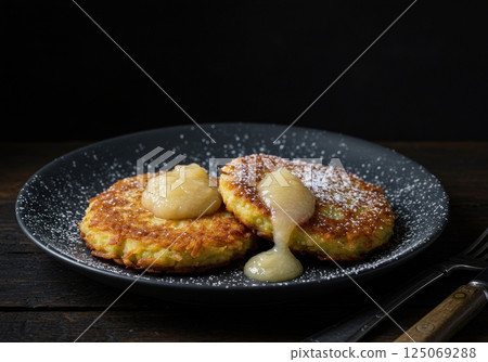 Enjoying Kartoffelpuffer with Applesauce in Germany at a Cozy Eatery 125069288
