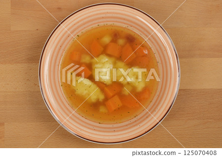 Clear soup with semolina dumplings Clear soup with semolina dumplings 125070408