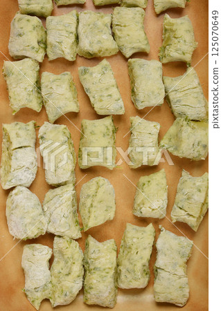 Raw potato and arugula gnocchi Raw potato and arugula gnocchi 125070649