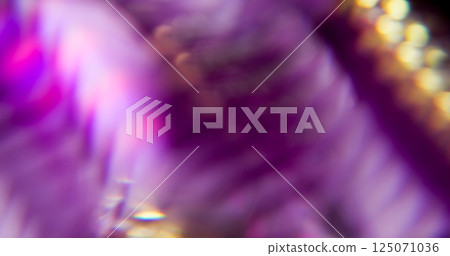 Rainbow geometric. Blur facet texture. Defocused purple crimson yellow color spectrum lens flare on abstract light background. 125071036