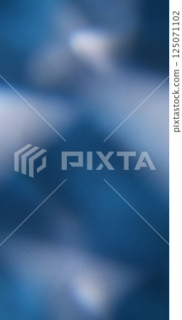 Abstract background. Blur light. Defocused blue colorful lens flare sparks crystal texture glint floating on dark black art. 125071102