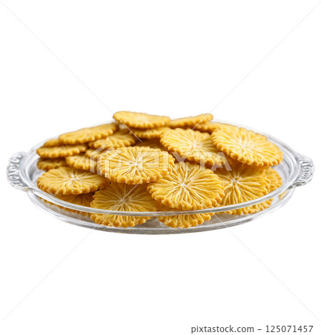 Ghevar crispy and disc shaped in a clear glass tray three quarter 125071457