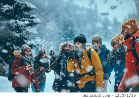 Group of hikers are enjoying a beautiful snowy day as they make their way through a snowy forest Group of hikers are enjoying a beautiful snowy day as they make their way through a snowy forest 125071719