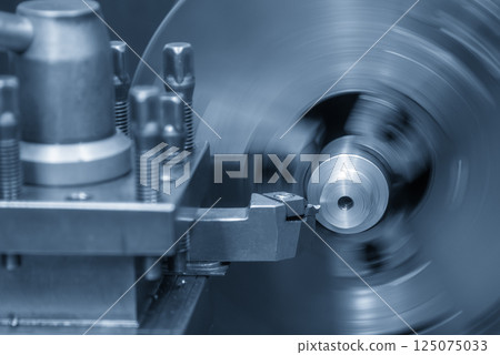 Closeup scene the lathe machine finish cut the metal parts in the light blue scene. 125075033