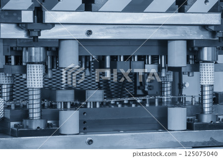 The metal forming process by progressive die in the light blue scene. 125075040