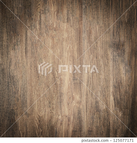 Dark brown wood grain texture background showing knots and growth rings Dark brown wood grain texture background showing knots and growth rings 125077171