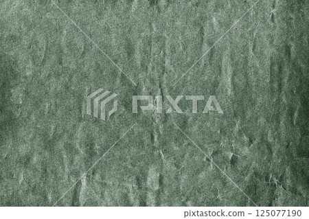 Green textured background showing rough surface with cracks and scratches 125077190
