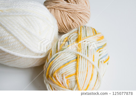 Colorful yarn collection on white background 125077878