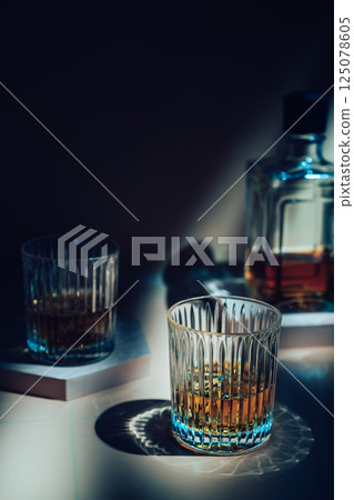Whiskey with ice in glasses 125078605