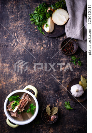 Boiled bone broth or bouillon with meat 125080112