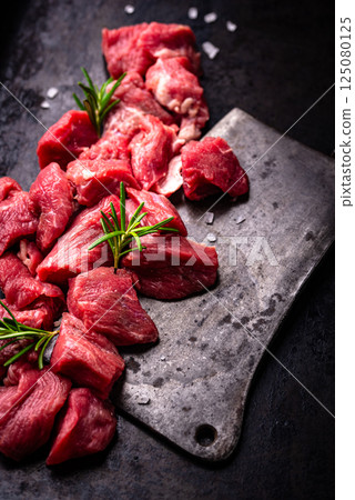 Raw beef meat and ingredients for cooking Raw beef meat and ingredients for cooking 125080125