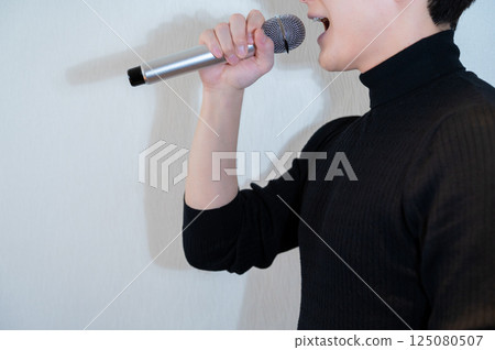 A man sang at a karaoke A man sang at a karaoke 125080507