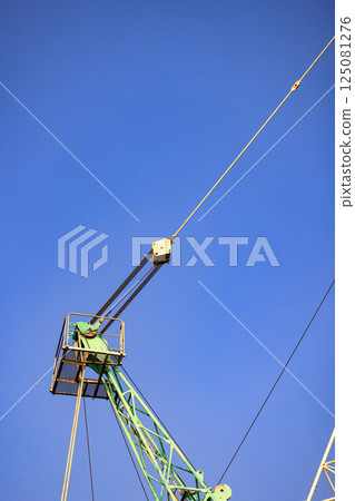 Structure part of the pulley attach to Big crane in an industrial port. Structure part of the pulley attach to Big crane in an industrial port. 125081276