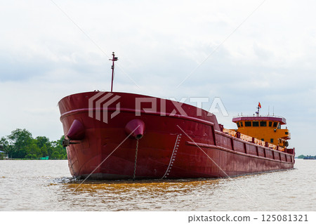 Old weathered general cargo ship on Mekong river, Vietnam Old weathered general cargo ship on Mekong river, Vietnam 125081321