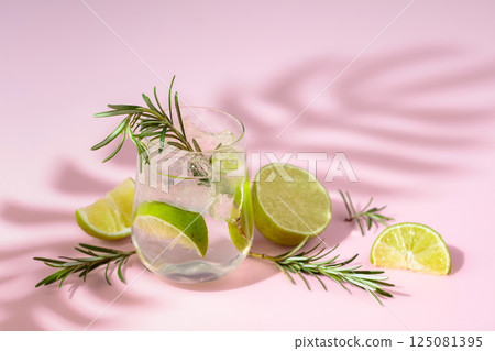Summer refreshing drink with ice, lime and rosemary. 125081395