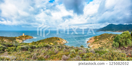 Attractive morning view  of Piscinni bay with turquoise sea and famous coastal tower of Piscinni. 125082032