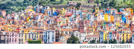 Attractive morning panorama of colourful houses of old town Bosa in Sardinia. Attractive morning panorama of colourful houses of old town Bosa in Sardinia. 125082055