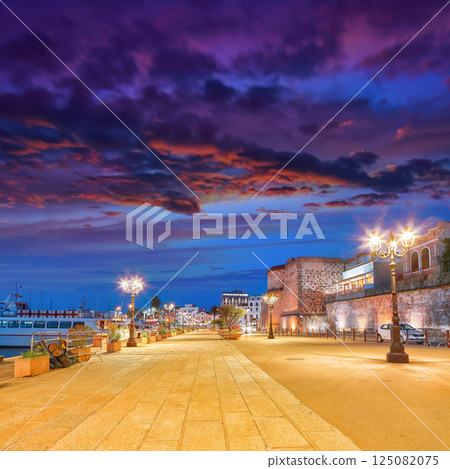 Unbelivable evening cityscape of historical part of Alghero town. Fantastic Mediterranean seascape. Unbelivable evening cityscape of historical part of Alghero town. Fantastic Mediterranean seascape. 125082075