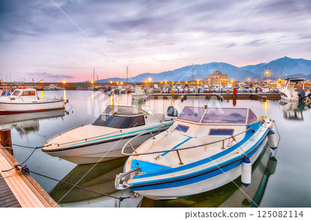 Remarkable  sunset view on boats in beautiful marina of Villasimius. 125082114