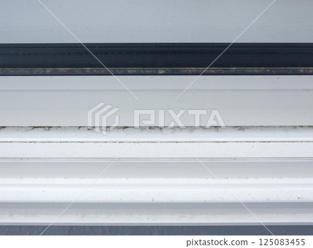 Dust on window sashes 125083455