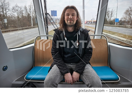 Travelling by tram through the city Travelling by tram through the city 125083785