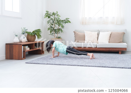 Child doing push-ups Child doing push-ups 125084066