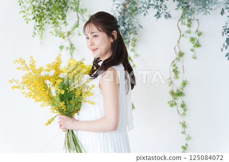Woman with a bouquet Woman with a bouquet 125084072