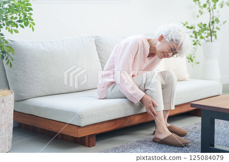 Senior woman with calf pain Senior woman with calf pain 125084079