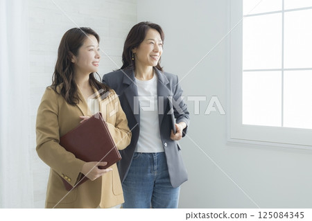 two businesswomen 125084345