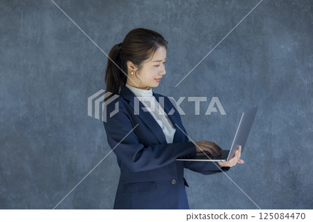 Woman in a suit Woman in a suit 125084470