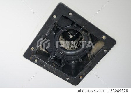 Ventilation fan being disassembled and cleaned (bathroom) 125084578