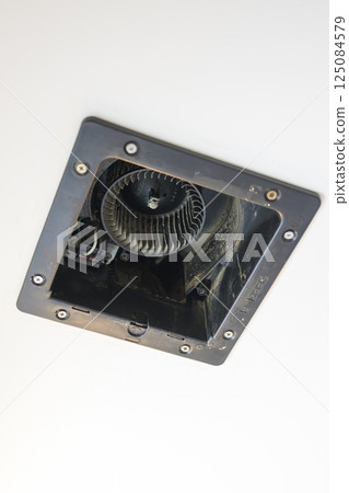 Ventilation fan being disassembled and cleaned (bathroom) 125084579