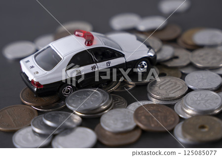 Police car on top of money coins cash 125085077