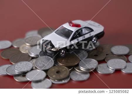 Police car on top of money coins cash 125085082