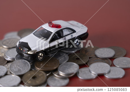 Police car on top of money coins cash 125085083