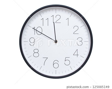 Simple wall clock with black frame and white face displaying 11:50 or 23:50. Ideal for time, schedule, and punctuality themes. 125085149