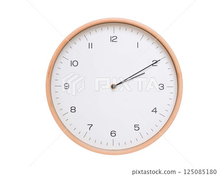 Minimal wall clock with light wood frame and white face displaying 02:10 or 14:10. Perfect for clean, modern concepts about time and scheduling. 125085180